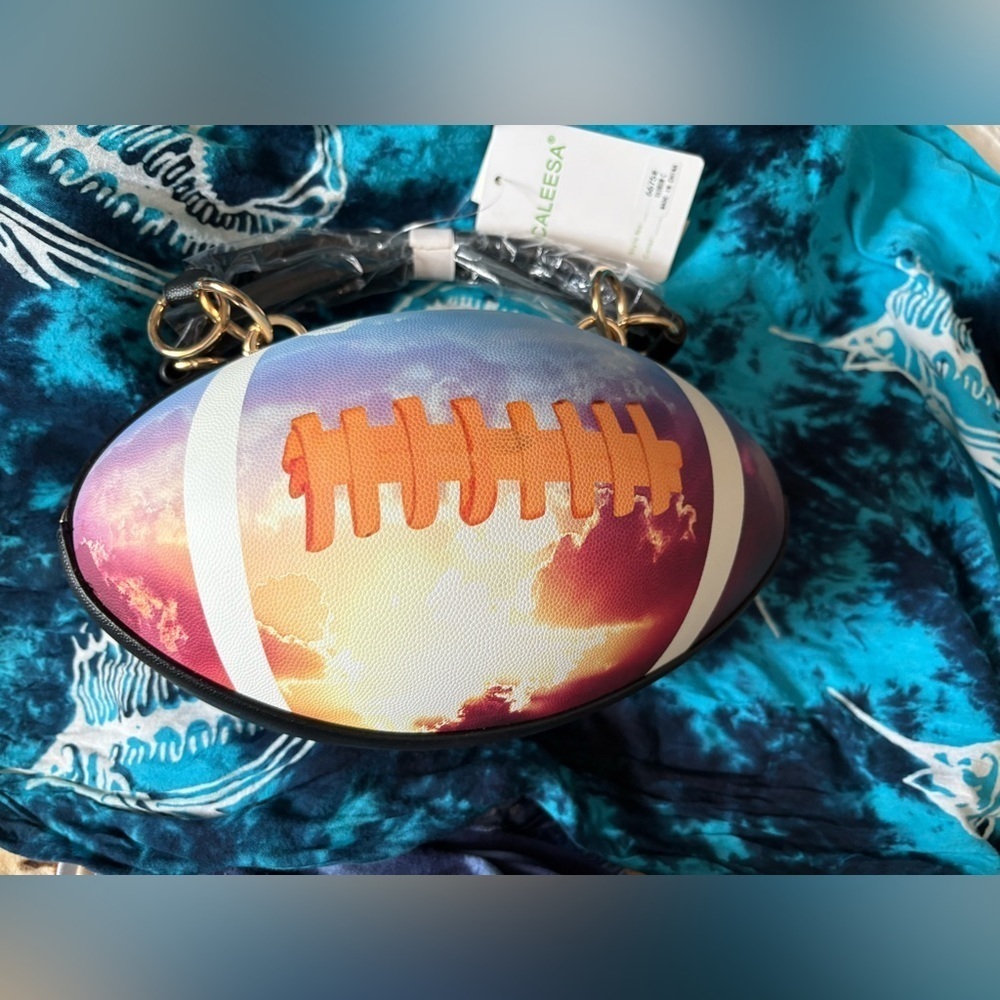 New- tie-dyed football clouds textured purse gold hardware. NFL lover perfect